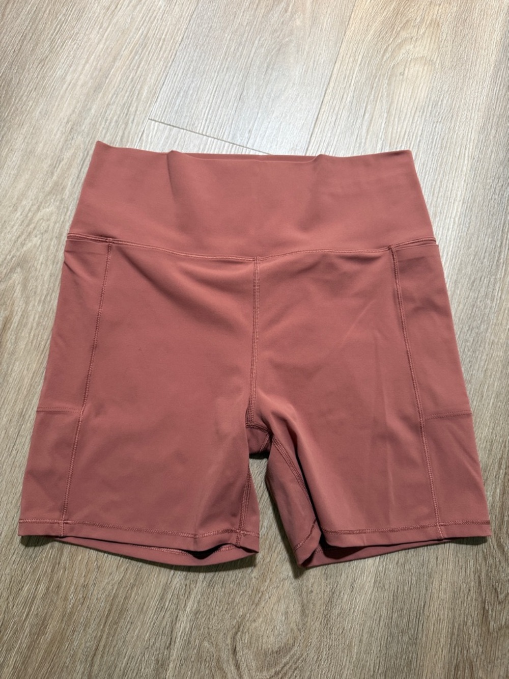Vuori Stride Stride Shorts in Rose Clay with side pockets